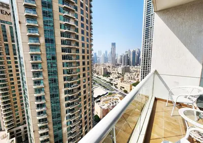 an apartment balcony with a view of a city at RH- Contemporary & Comfortable, Studio near Dubai mall in Dubai