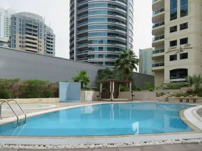 a large swimming pool with buildings in the background at Frank Porter - Yach Bay in Dubai
