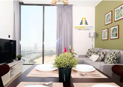 a living room with a couch and a large window at Fully Furnished 1 Bed in Sobha Creek Vista hosted by Desert City Stays in Dubai