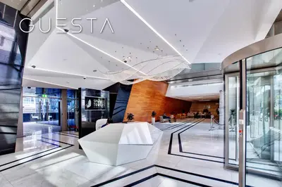 a lobby of a store with a white bench in it at Sparkle Tower - Studio, Dubai Marina in Dubai