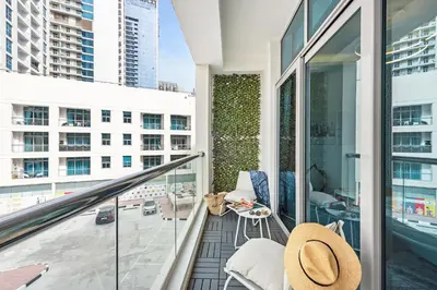 a balcony with a view of a city at Unique Dubai Marina Studio, near Jumeirah Beach, Mall and Metro in Dubai