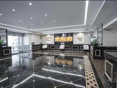 a large lobby with a pool in the middle of a building at Most enjoyable 2BR apartment in Dubai marina in Dubai