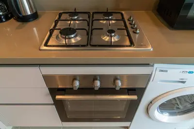 a stove top oven sitting on top of a counter at 10min from Burj Khalifa - Sobha Creek Vistas Réservé in Dubai