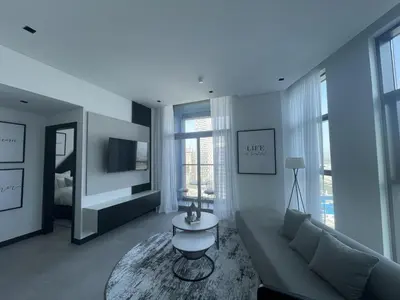 a living room with a couch and a table at Iconic !Luxurious 1 Bed Apartment! in Dubai