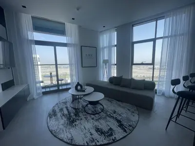 a living room with a couch and a table at Iconic !Luxurious 1 Bed Apartment! in Dubai