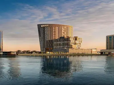 a large building next to a large body of water at Iconic !Luxurious 1 Bed Apartment! in Dubai