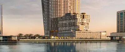 a rendering of a tall building next to a body of water at Iconic !Luxurious 1 Bed Apartment! in Dubai