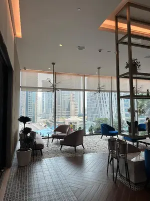 a large living room with a view of a city at LUXURY 1 BR Apartment at Marina Gate Jumeirah Living in Dubai