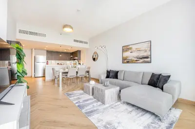 a living room with a couch and a table at Ultra Luxury Wasl 1 Residences Zabeel Park in Dubai