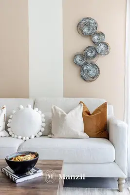 a living room with a couch with a bowl on a table at Elegant 3BR in a Prime Location Near Metro, Business Bay in Dubai