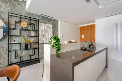a kitchen with a sink and a counter top at GuestReady - Beachfront heaven with stunning views in Dubai