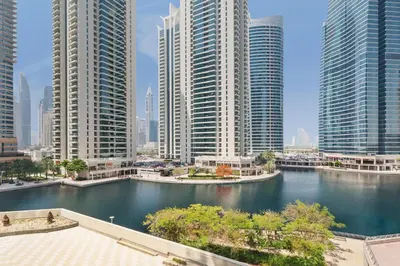 a view of a river in a city with tall buildings at Luxury JLT Studio Lakeview Pool & Marina Walk in Dubai