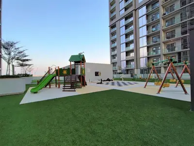 a park with a playground with a slide at New 1 bedroom in Sobha Hartland in Dubai