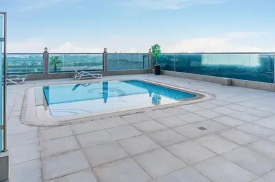 a swimming pool on the roof of a building at Burj Khalifa View I Near to Dubai Mall in Dubai