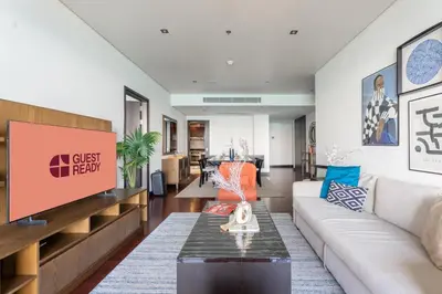 a living room with a couch and a table at GuestReady - A Glimpse of Burj Al Arab in Dubai