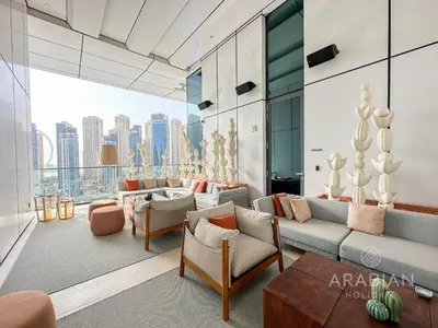 a living room with a view of the city at BRAND-NEW 1 Bedroom with full Marina View in Dubai