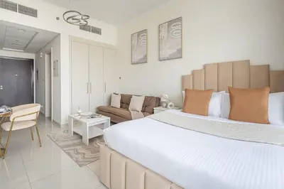 a bedroom with a large bed and a living room at Frank Porter - Carson A in Dubai