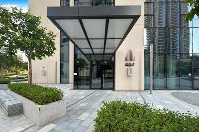 a lobby of a building with a glass door at bnbme - Luxury 1BR Apt w Burj Khalifa Views Pool Gym & Prime Location Near Dubai Mall in Dubai