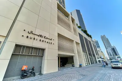 a building with a motorcycle parked in front of it at FIRST CLASS 2BD, Full Burj Khalifa view in the Heart of Downtown in Dubai
