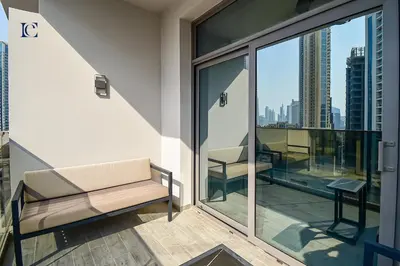 a balcony with a bench and a view of the city at Luxury Escapes - Large & Brand New Studio Apt Business Bay - MAG in Dubai