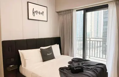 a bedroom with a bed and a large window at Quasi-Hotels Zada Cozy Lux in Business Bay 1BR in Dubai