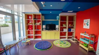 a childs room with red and blue walls at Luxurious Studio in Business Bay by Tanami Holiday Homes in Dubai