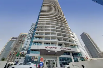 a large building with a sign on the side of it at Laguna Tower - Peaceful One Bedroom in Dubai