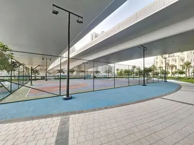 a tennis court in a building with a tennis court at Vacationer I Premium One Bed with Skyline Views I Summer Creek Beach Tower 2, Dubai Creek Harbour in Dubai