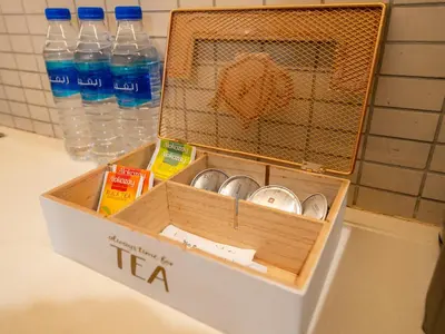 a box filled with water bottles on a counter at EasyGo - Exceptional 2BDR- Large Terrace-Pool Access in Dubai
