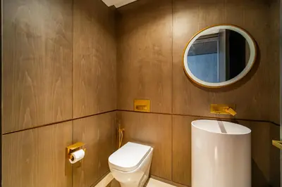 a bathroom with a toilet and a mirror at Five Palm Super Luxury Apt with Full Sea Views in Dubai