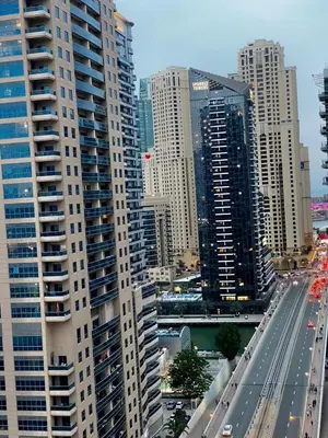 a view of a city with tall buildings and a highway at Spacious Studio Apartment in Dubai Marina with Balcony in Dubai