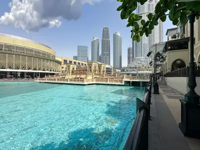 a large swimming pool in the middle of a city at Trophy - Euphoria Eclipse Suite in 29th floor in Burj Royale in Dubai