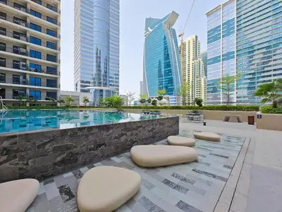 a pool in the middle of a city with buildings at Business Bay's Coziest Hideaway With Balcony in Dubai