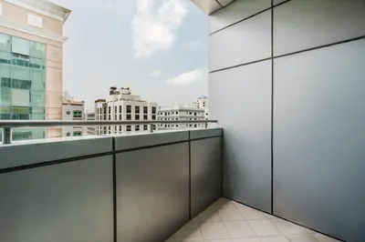 a balcony with a view of a city at RH- Exquisite & Spacious 01 BR, Near Mall of the Emirates in Dubai