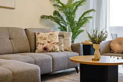 a living room with a couch and a table at Extravagant 3BR + kid's room w/ Burj Khalifa view in Dubai