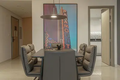 a dining room with a table and chairs at Paramount Tower Hotel and Residences with Infinity Sky Pool in Dubai