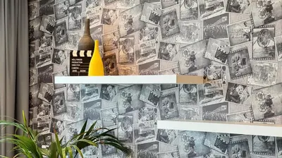 a wall with a poster of movies on it at Paramount Tower Hotel and Residences with Infinity Sky Pool in Dubai