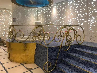 a set of stairs in a room with a blue wall at Luxury 2BR Panoramic Marina Views High Floor in Dubai