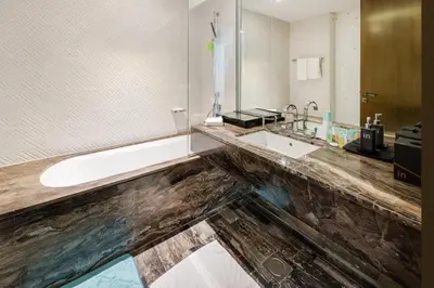 a bathroom with a sink and a mirror at Luxury 2BR Panoramic Marina Views High Floor in Dubai