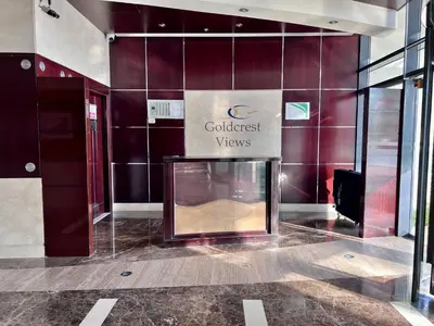 a building with a fireplace in the middle of a lobby at Cosmos Living Spacious with Balcony GCV1 in Dubai