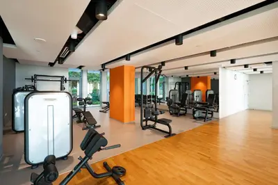a gym with several treadmills and exercise bikes at GuestReady - Majestic Ain Dubai from your balcony in Dubai
