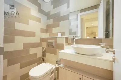 a bathroom with a sink and a toilet at Mira Holiday Homes - Lovely 1 bedroom with beach access in Dubai