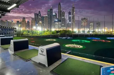 a golf course with a city skyline in the background at Special Rates - Elegant Studio - Golf Views in Dubai
