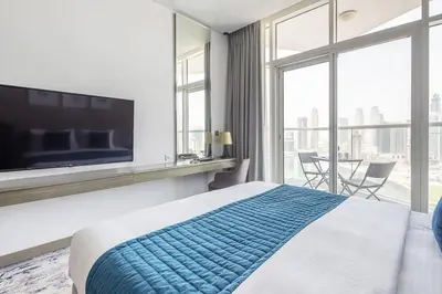 a hotel room with a bed and a large window at Frank Porter - Prive A in Dubai