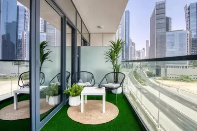 an office balcony with a table and chairs at GuestReady - A sophisticated and refined dwelling in Dubai