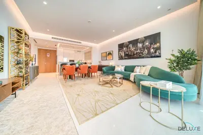 a living room with a couch and a table at Picturesque 3BR with Assistant Room at The One JBR by Deluxe Holiday Homes in Dubai