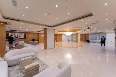 a lobby with couches and chairs in a building at Havana Holiday Homes Oud Metha in Dubai