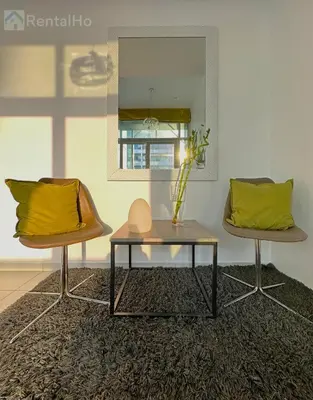 a living room with a table and two chairs at Lxry Full Marina View & RoofTop Pool 40% OFF in Dubai
