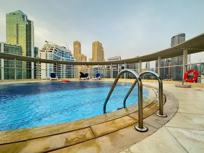 a swimming pool on the roof of a building at Lxry Full Marina View & RoofTop Pool 40% OFF in Dubai
