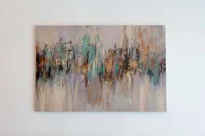 a painting hanging on a wall at Serenity Studio in Dubai